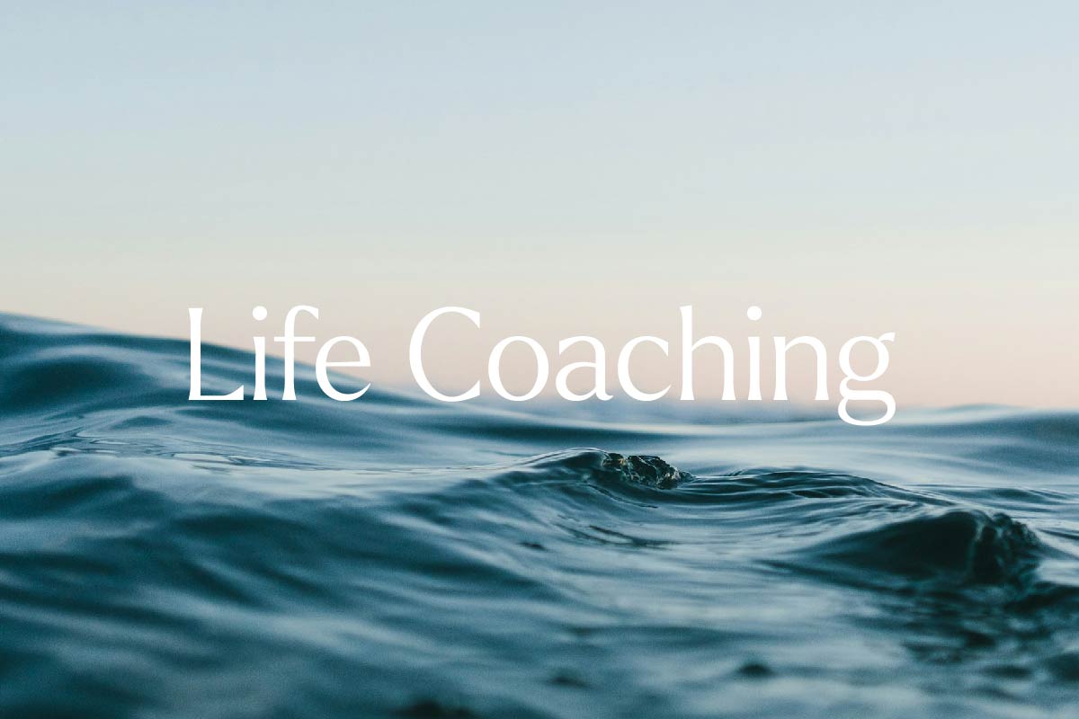 Closeup of gentle wave and text Life coaching